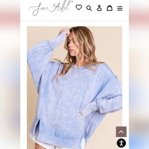 Bright Orange Red Sweatshirt With Exposed Seams And Slits At Bottom And sleeves